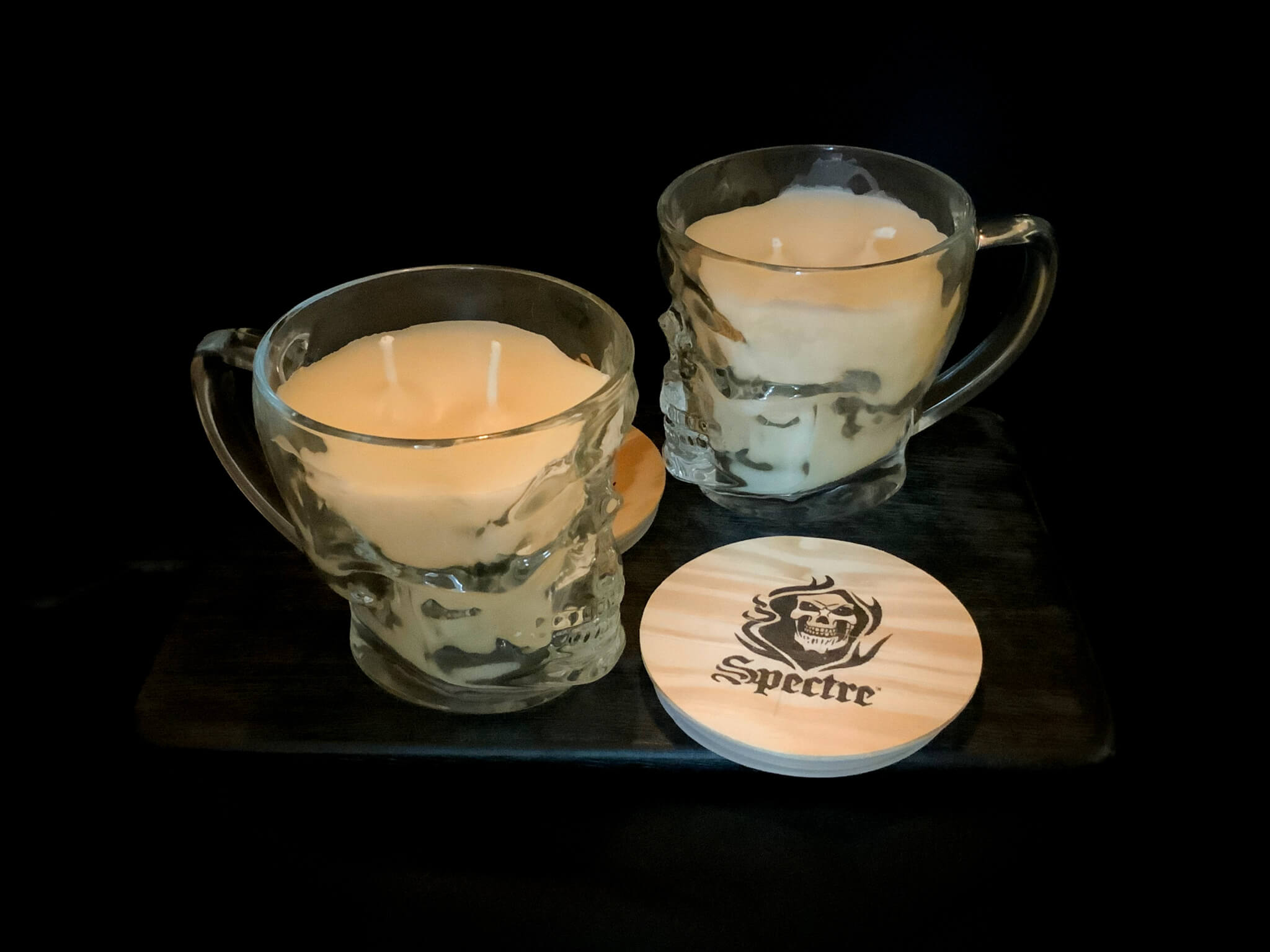 two skull mug candles, unlit